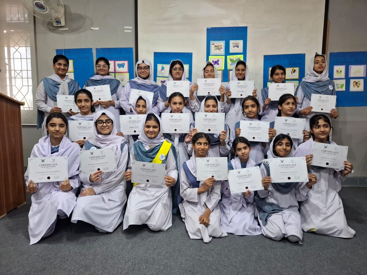 ERA Professionals Butterfly Effect Club students holding their TrueSight DAO credentials